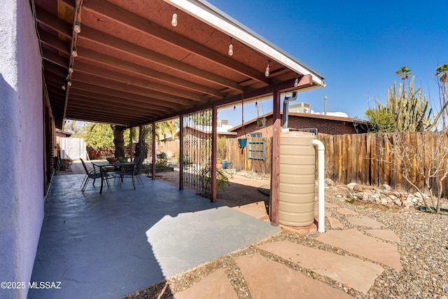 view of patio / terrace with outdoor dining area and a fenced backyard