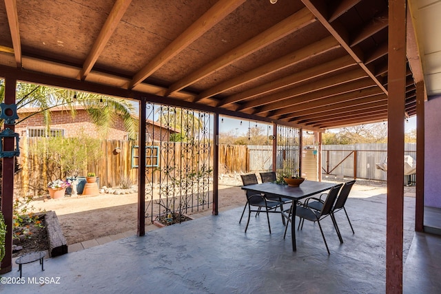 view of patio featuring outdoor dining area and a fenced backyard