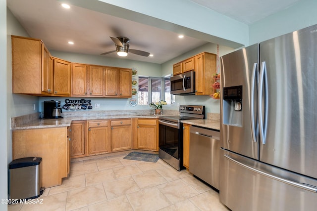 kitchen with light stone countertops, recessed lighting, ceiling fan, appliances with stainless steel finishes, and brown cabinets