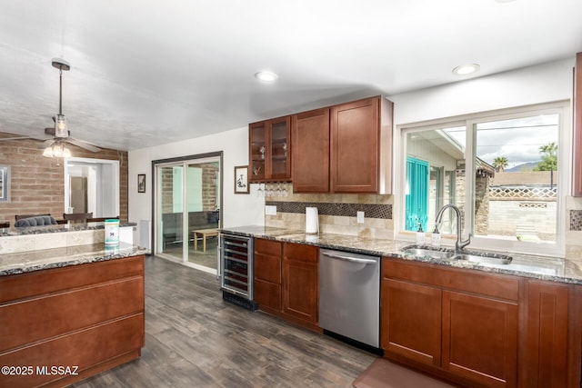 kitchen featuring dark wood-style flooring, a sink, wine cooler, dishwasher, and tasteful backsplash