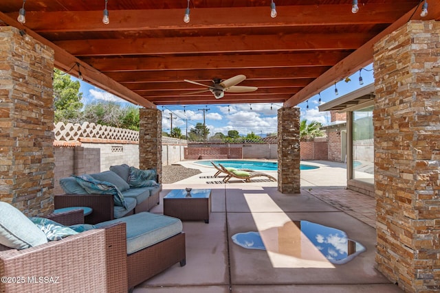 view of patio featuring an outdoor living space, a ceiling fan, a fenced backyard, and a fenced in pool