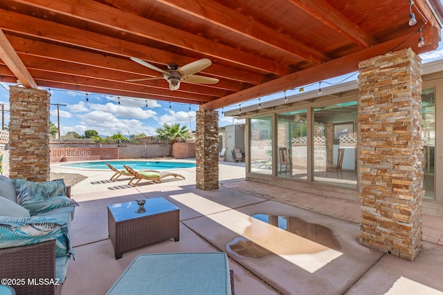 view of patio / terrace featuring a fenced backyard, a fenced in pool, outdoor lounge area, and a ceiling fan