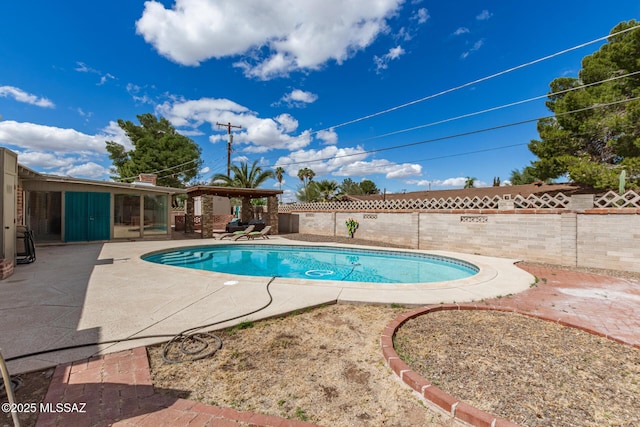 view of swimming pool featuring a patio area, a fenced in pool, and a fenced backyard