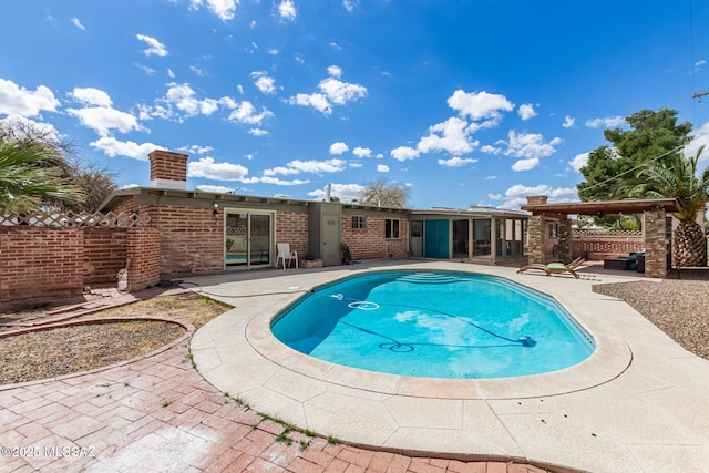 view of swimming pool featuring a fenced in pool, fence, and a patio area