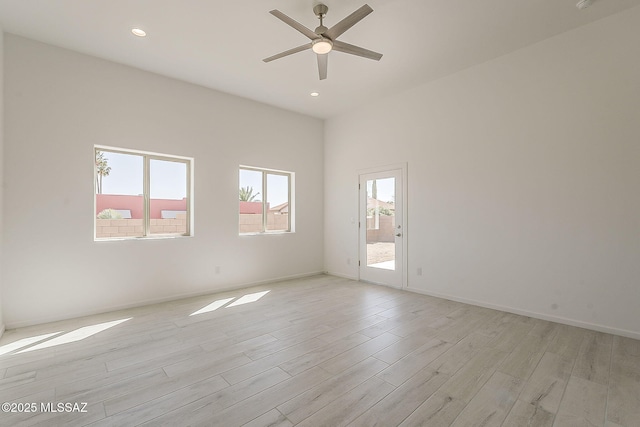 unfurnished room featuring light wood-style flooring, recessed lighting, baseboards, and ceiling fan