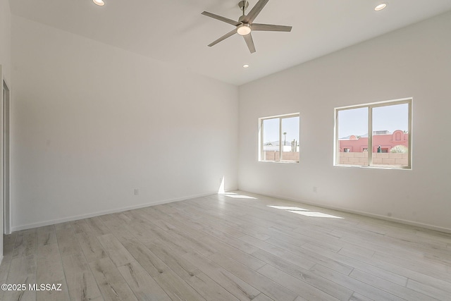 spare room featuring light wood finished floors, recessed lighting, and a ceiling fan