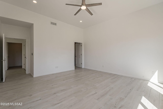 spare room featuring visible vents, recessed lighting, light wood-style floors, baseboards, and ceiling fan