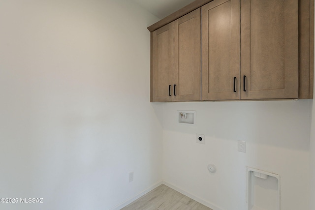 laundry room featuring washer hookup, cabinet space, light wood-style floors, baseboards, and hookup for an electric dryer