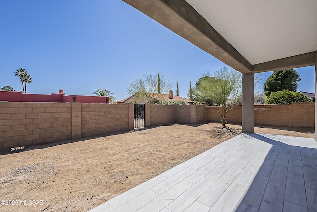 view of patio / terrace with a fenced backyard and a gate