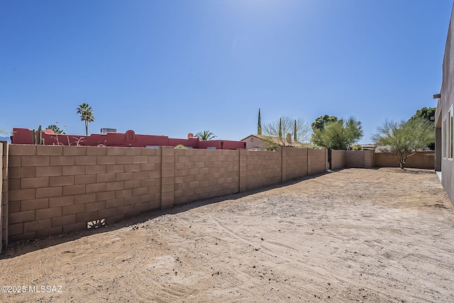 view of yard with a fenced backyard