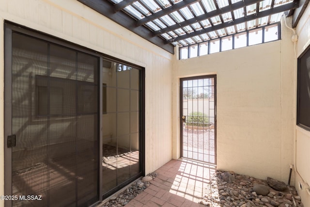 property entrance with a pergola