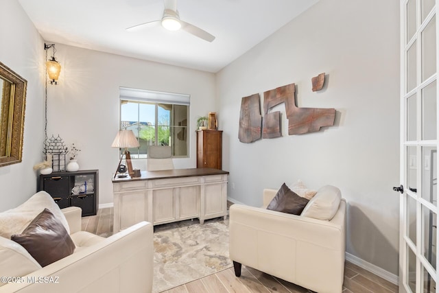 office with baseboards, ceiling fan, and wood tiled floor