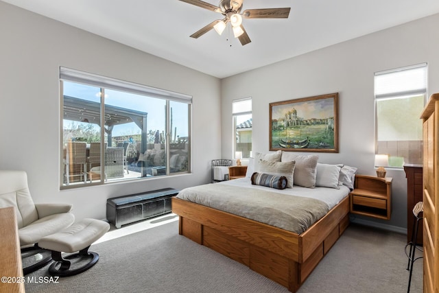 bedroom featuring light colored carpet and ceiling fan