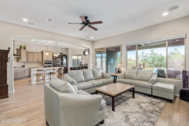 6909 W Cliff Spring Trl, Marana, AZ 85658 - living area with ceiling fan, light wood-style flooring, and recessed lighting