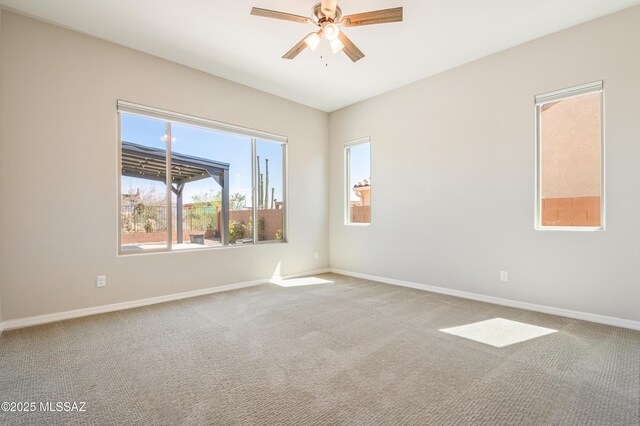 6909 W Cliff Spring Trl, Marana, AZ 85658 - carpeted spare room with ceiling fan and baseboards