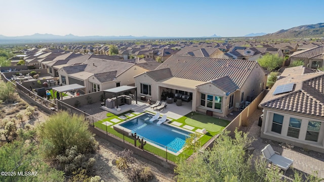 drone / aerial view featuring a mountain view and a residential view