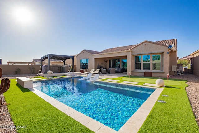 6909 W Cliff Spring Trl, Marana, AZ 85658 - view of swimming pool with outdoor lounge area, a fenced backyard, a patio area, a gazebo, and a putting area