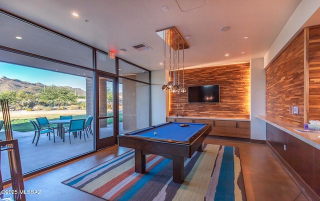 6909 W Cliff Spring Trl, Marana, AZ 85658 - playroom with concrete floors, billiards, floor to ceiling windows, and recessed lighting