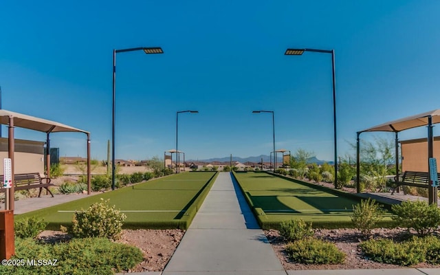 6909 W Cliff Spring Trl, Marana, AZ 85658 - view of home's community featuring a game area and a mountain view
