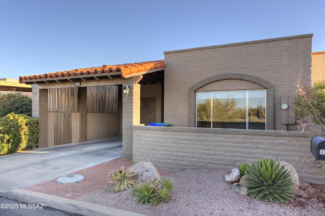 view of front of home featuring a tiled roof