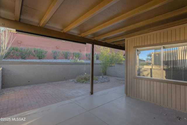 view of patio / terrace featuring fence