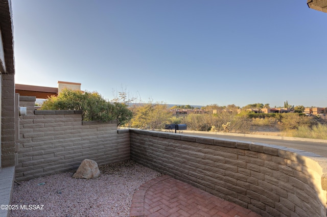 view of patio / terrace featuring fence