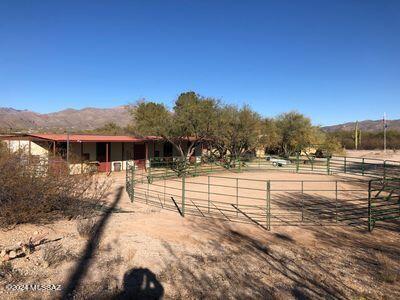 exterior space with an exterior structure, a mountain view, an outbuilding, and a rural view