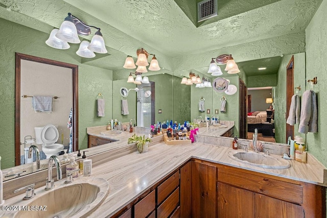 full bath featuring a sink, visible vents, and double vanity