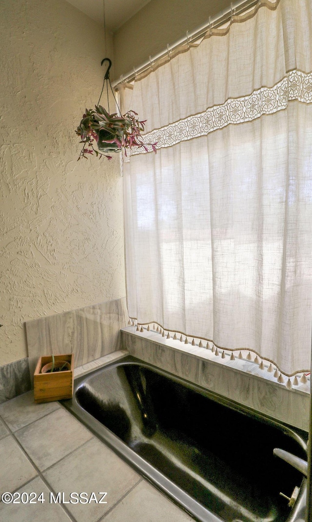 full bath with a textured wall