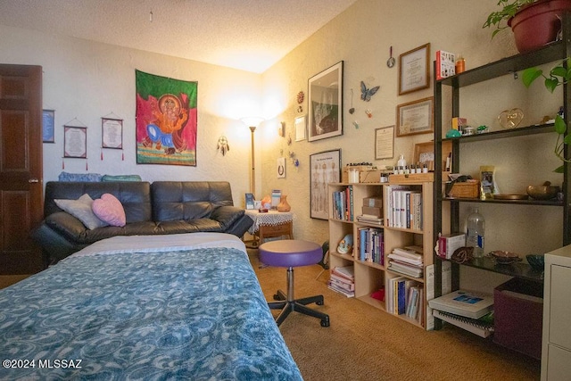 carpeted bedroom with a textured ceiling