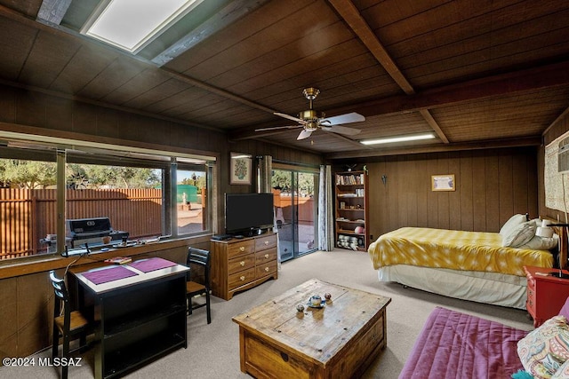 bedroom with wooden walls, wood ceiling, carpet flooring, and access to outside