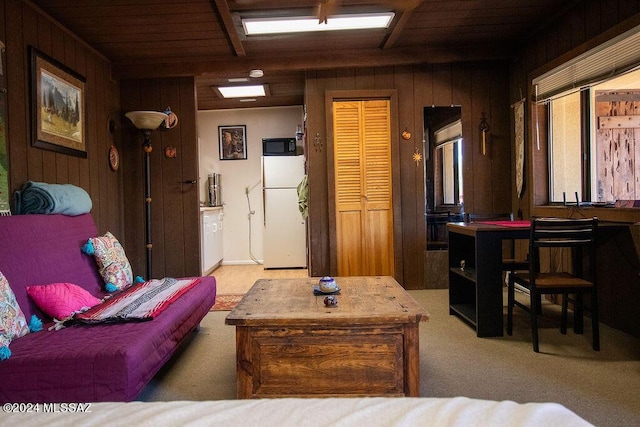 living room with wood walls and wooden ceiling