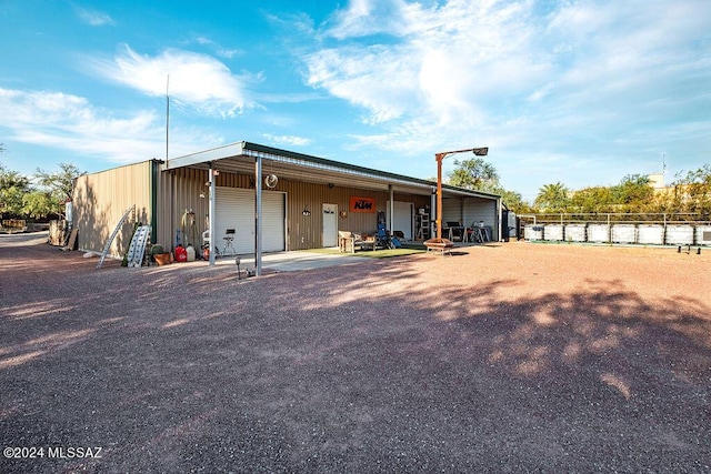 view of outbuilding with fence