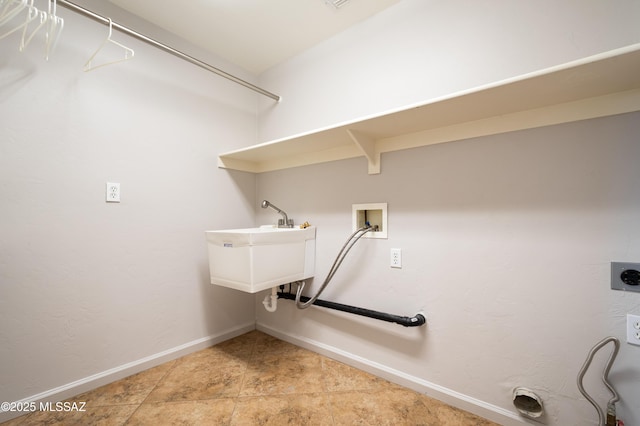 clothes washing area featuring laundry area, hookup for a washing machine, baseboards, and electric dryer hookup