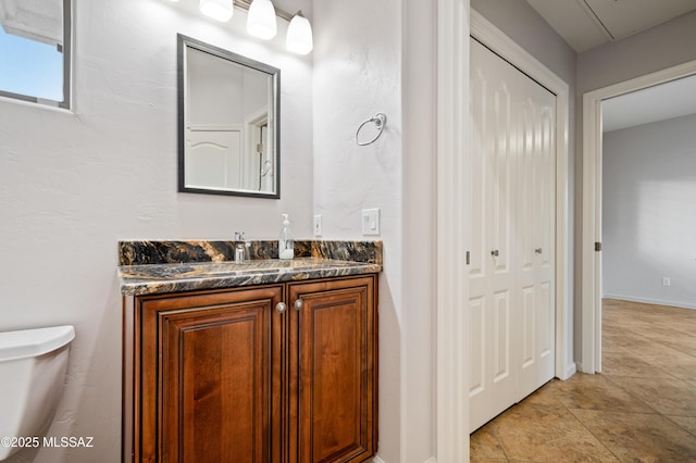 half bath with vanity and toilet