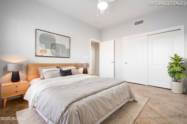 bedroom featuring visible vents, a closet, and ceiling fan