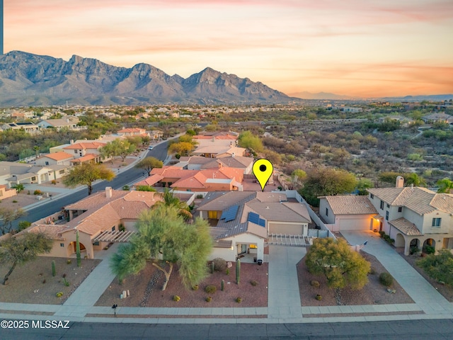 drone / aerial view featuring a residential view and a mountain view