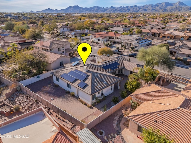 birds eye view of property featuring a mountain view and a residential view