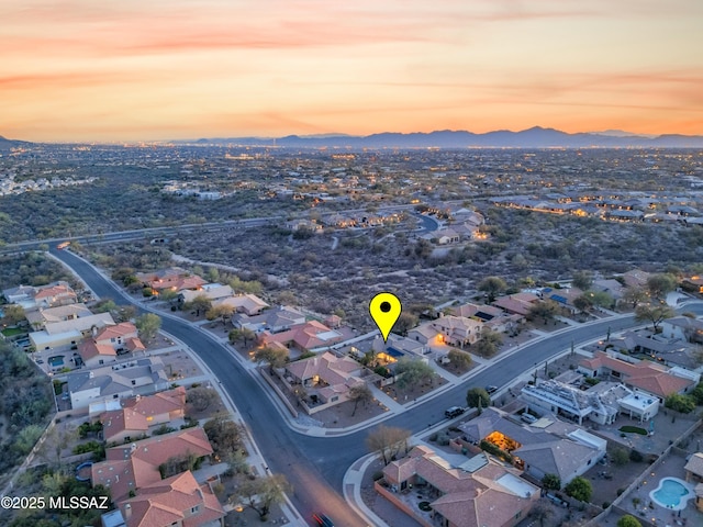 drone / aerial view featuring a residential view and a mountain view