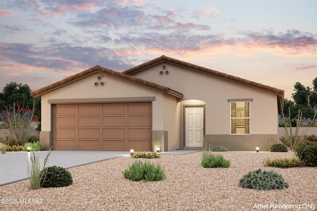 mediterranean / spanish-style house featuring stucco siding, an attached garage, a tile roof, and driveway