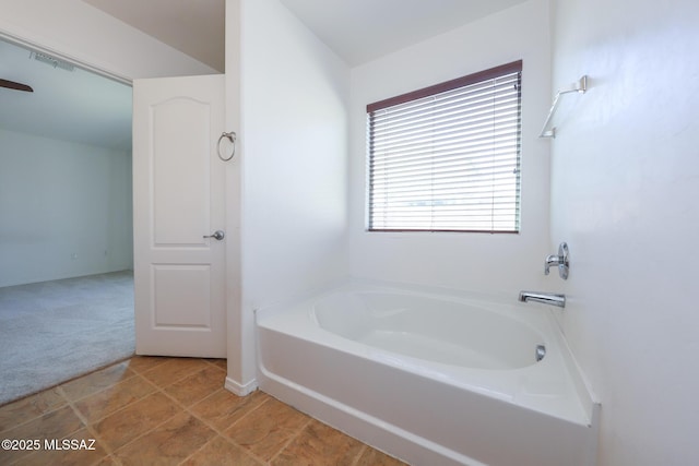 full bathroom featuring tile patterned floors, visible vents, and a bath