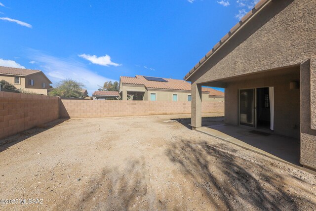 view of yard featuring a patio area and a fenced backyard