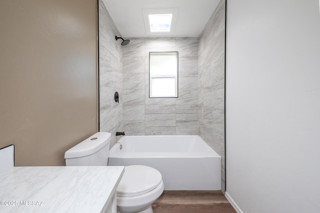 full bath with vanity, washtub / shower combination, toilet, and wood finished floors