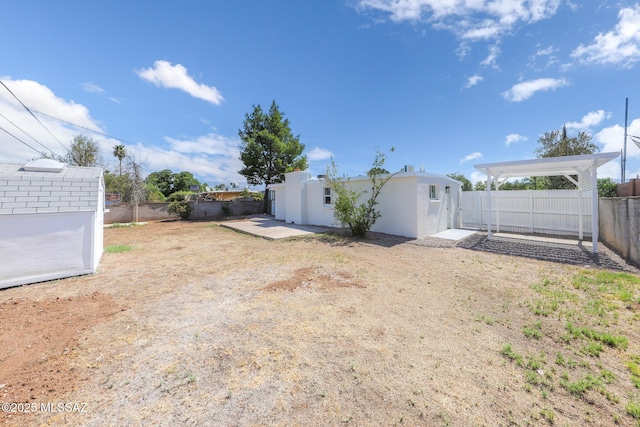 view of yard featuring an outbuilding and a fenced backyard