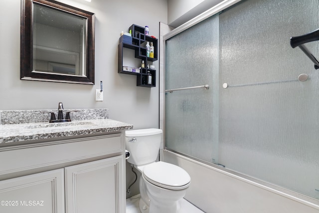 full bath with vanity, toilet, and enclosed tub / shower combo