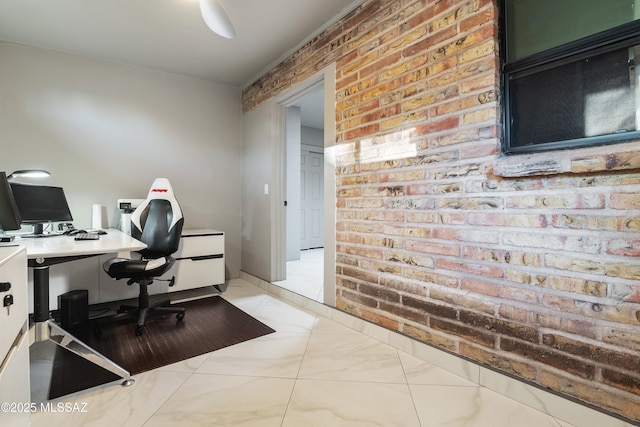 office featuring marble finish floor and brick wall