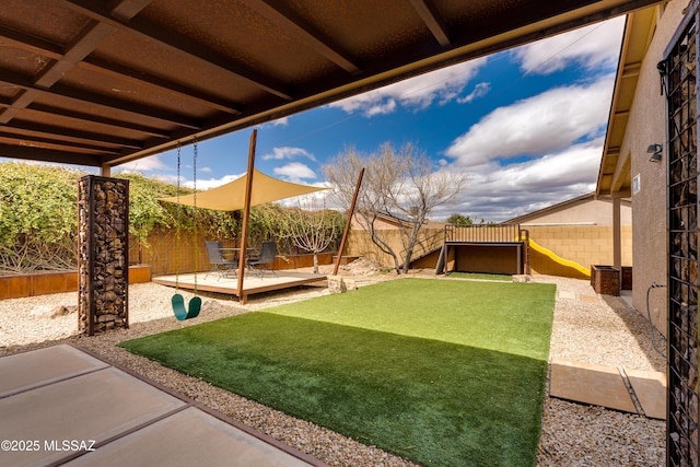 view of yard featuring a patio and a fenced backyard