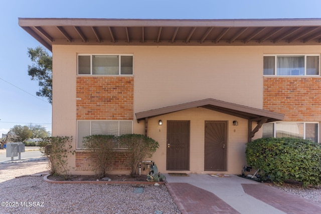 property entrance with brick siding