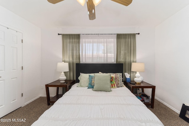 carpeted bedroom with baseboards and a ceiling fan