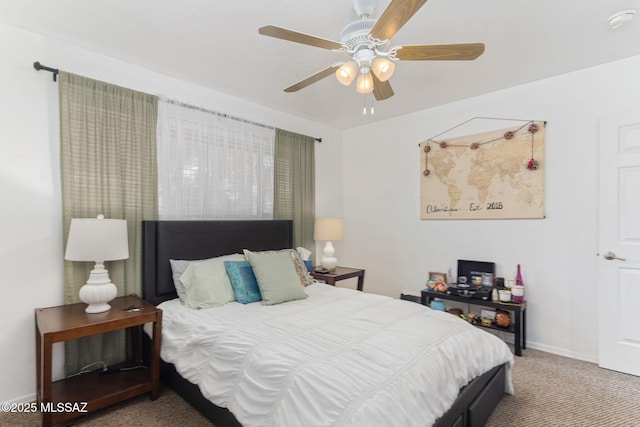 bedroom with baseboards, carpet, and a ceiling fan